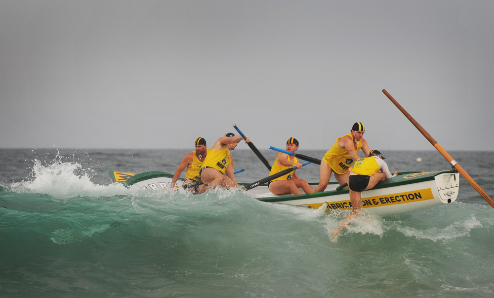 Reserves mens team Fairymeadow Finger Blasters compete in the Navy Surf Boat Challenge on Wollongong City Beach.